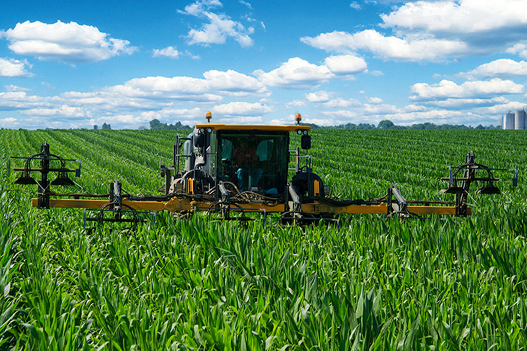 Hagie with attachment in the field